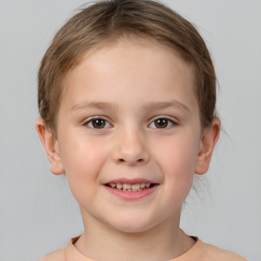 Joyful white child female with short  brown hair and brown eyes