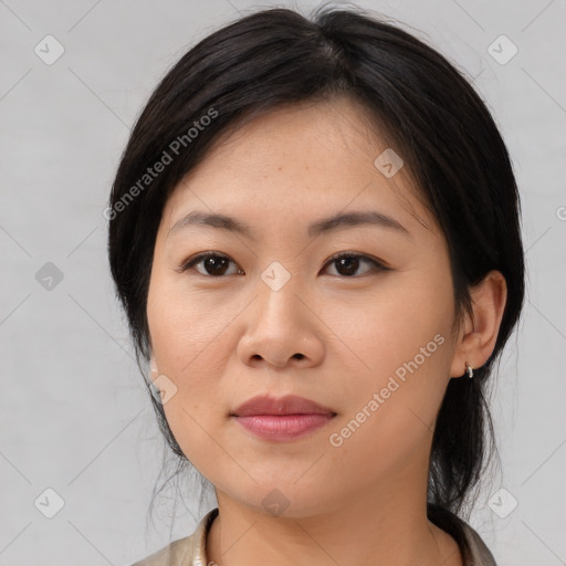 Joyful asian young-adult female with medium  brown hair and brown eyes