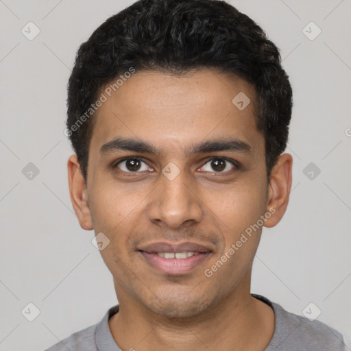 Joyful latino young-adult male with short  black hair and brown eyes