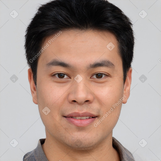 Joyful asian young-adult male with short  brown hair and brown eyes