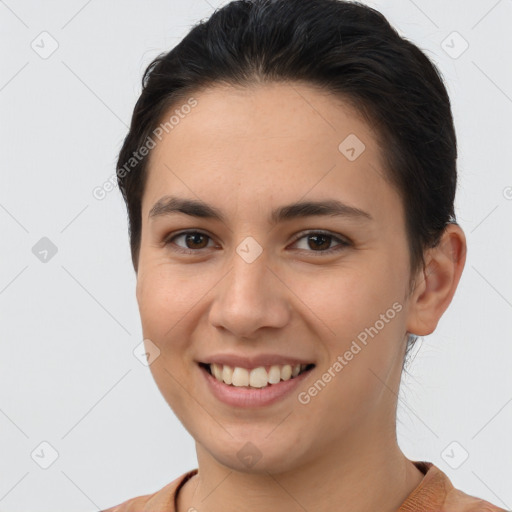 Joyful white young-adult female with short  brown hair and brown eyes