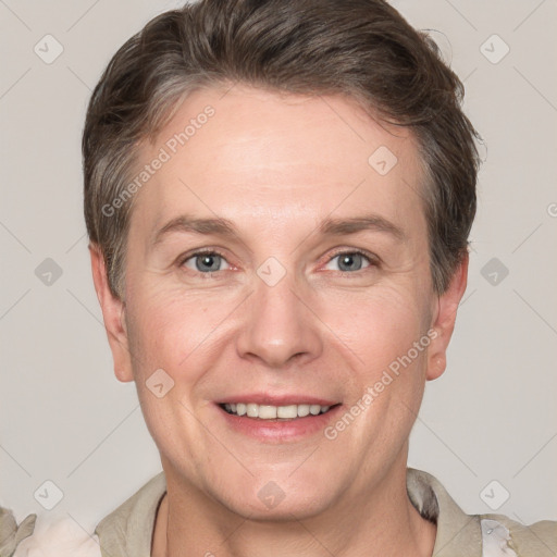 Joyful white adult male with short  brown hair and grey eyes