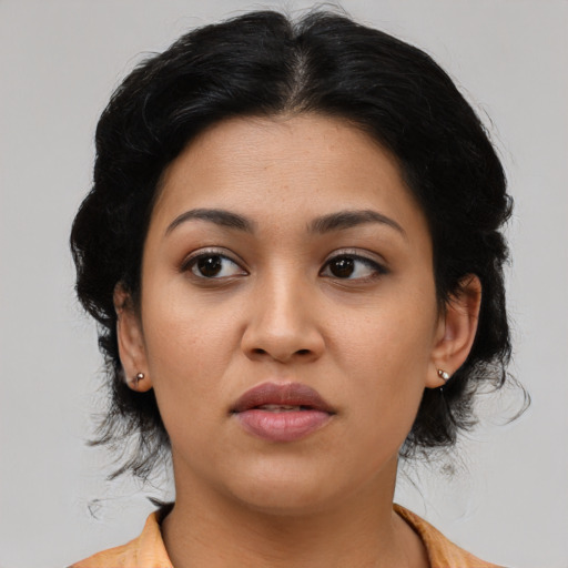 Neutral latino young-adult female with medium  black hair and brown eyes