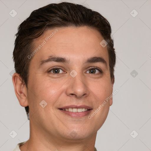 Joyful white young-adult male with short  brown hair and grey eyes