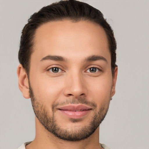 Joyful white young-adult male with short  brown hair and brown eyes