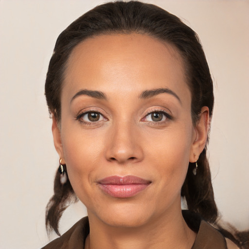 Joyful white young-adult female with medium  brown hair and brown eyes