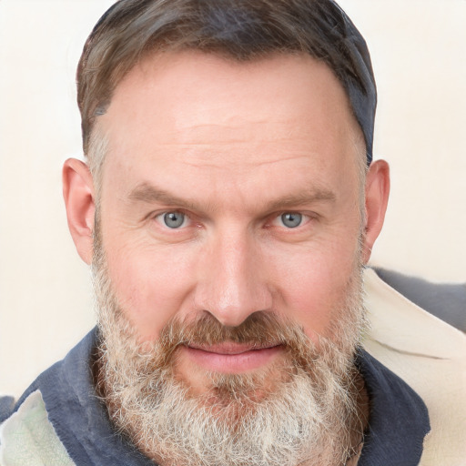 Joyful white adult male with short  brown hair and grey eyes