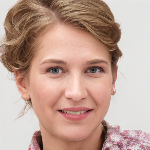 Joyful white young-adult female with medium  brown hair and blue eyes