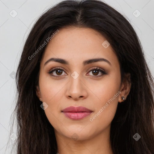 Joyful latino young-adult female with long  brown hair and brown eyes