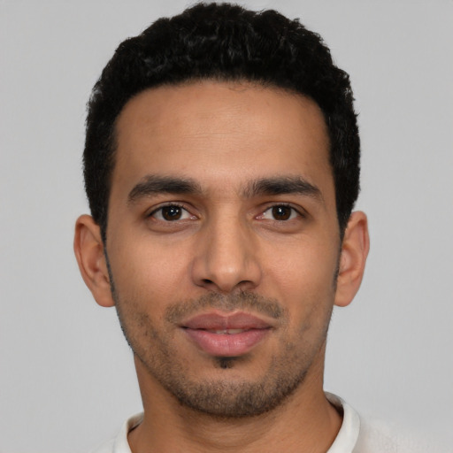 Neutral latino young-adult male with short  black hair and brown eyes