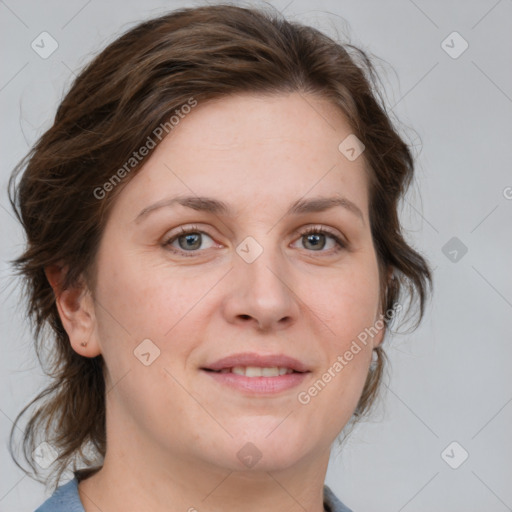 Joyful white young-adult female with medium  brown hair and blue eyes