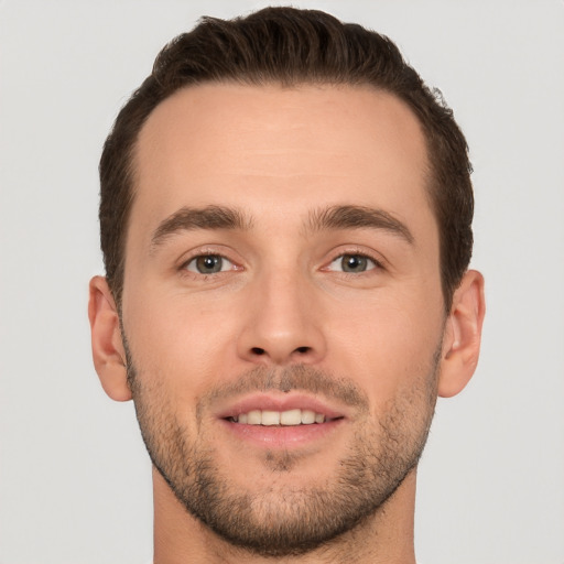 Joyful white young-adult male with short  brown hair and brown eyes