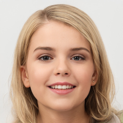 Joyful white child female with long  brown hair and brown eyes