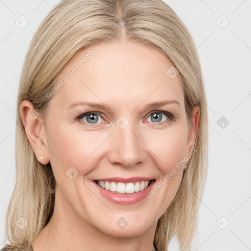 Joyful white young-adult female with medium  brown hair and blue eyes