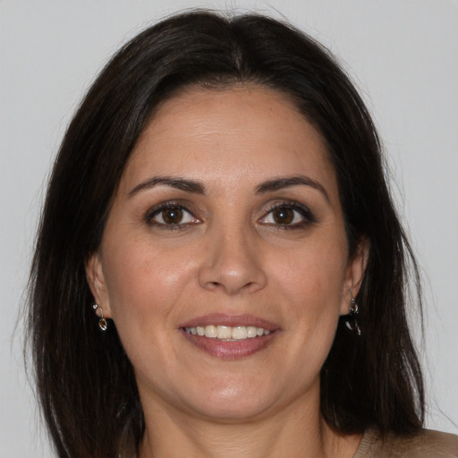 Joyful white adult female with medium  brown hair and brown eyes