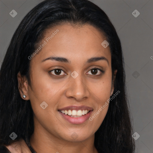 Joyful latino young-adult female with long  brown hair and brown eyes