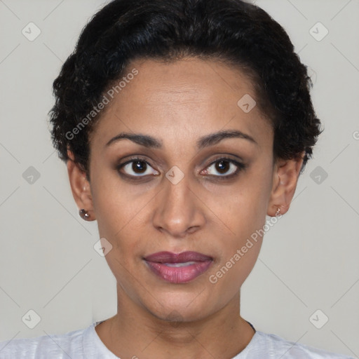 Joyful latino young-adult female with short  black hair and brown eyes