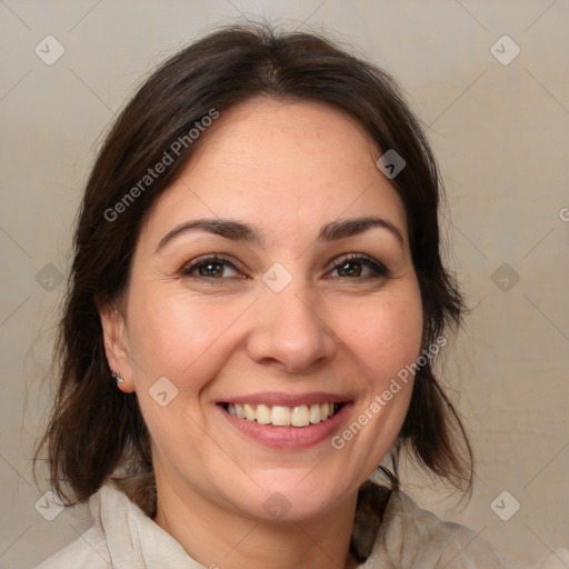 Joyful white adult female with medium  brown hair and brown eyes