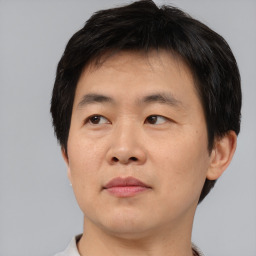 Neutral asian young-adult male with short  black hair and brown eyes