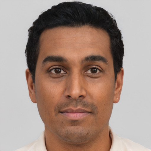 Neutral latino young-adult male with short  black hair and brown eyes