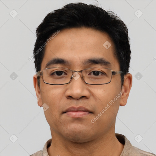 Neutral asian adult male with short  black hair and brown eyes