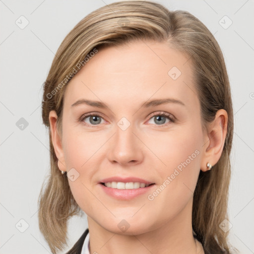 Joyful white young-adult female with medium  brown hair and grey eyes