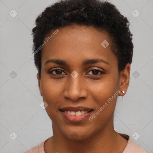 Joyful black young-adult female with short  black hair and brown eyes