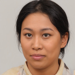 Neutral asian young-adult female with medium  brown hair and brown eyes