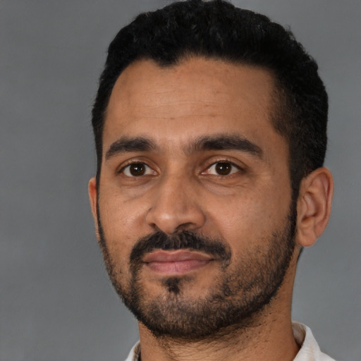 Neutral latino young-adult male with short  black hair and brown eyes