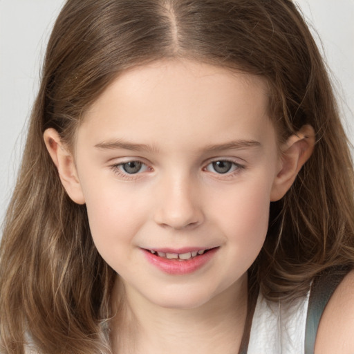 Joyful white child female with long  brown hair and grey eyes