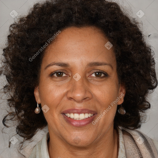 Joyful black adult female with medium  brown hair and brown eyes