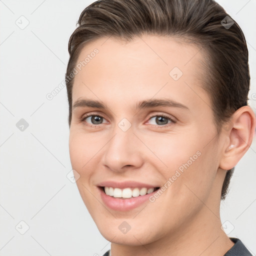 Joyful white young-adult female with short  brown hair and brown eyes