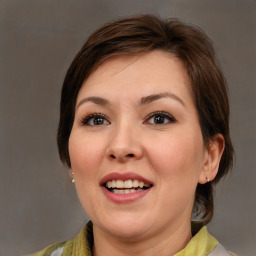 Joyful white adult female with medium  brown hair and brown eyes