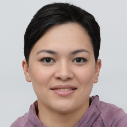 Joyful asian young-adult female with short  black hair and brown eyes