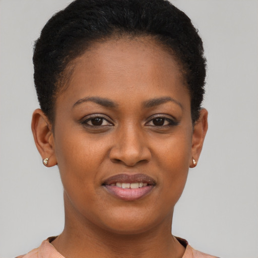 Joyful black young-adult female with short  brown hair and brown eyes