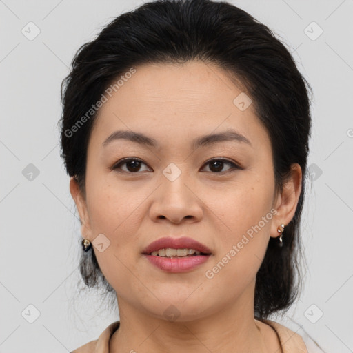 Joyful asian young-adult female with medium  brown hair and brown eyes