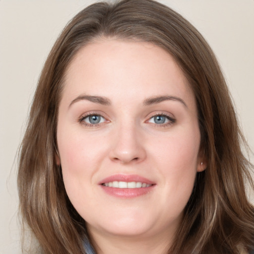 Joyful white young-adult female with long  brown hair and grey eyes