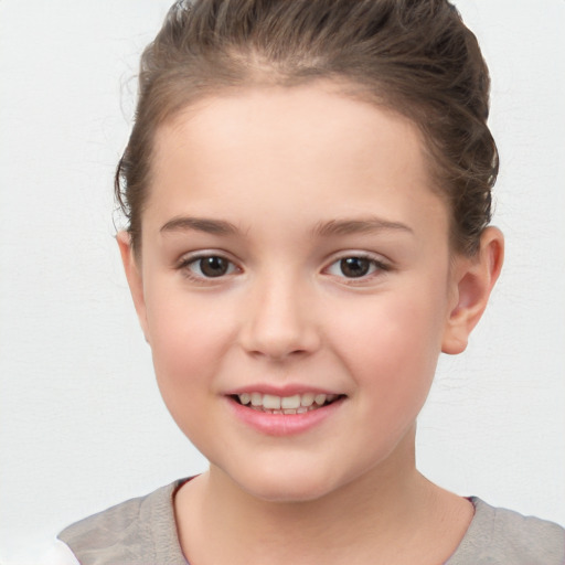 Joyful white child female with short  brown hair and brown eyes