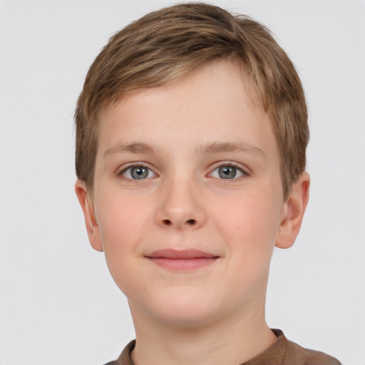 Joyful white child male with short  brown hair and grey eyes