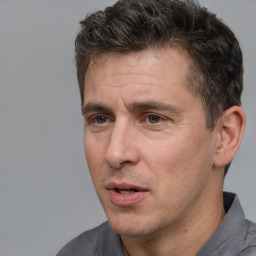 Neutral white adult male with short  brown hair and brown eyes