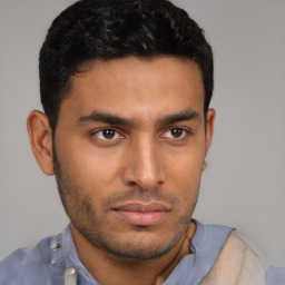 Neutral latino young-adult male with short  brown hair and brown eyes