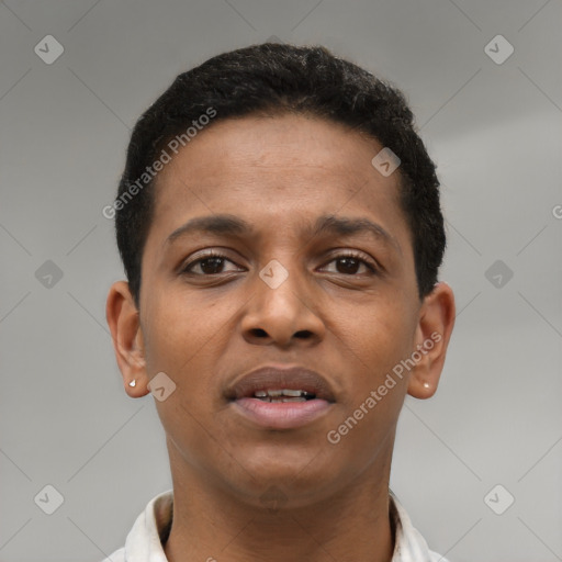Joyful latino young-adult male with short  brown hair and brown eyes