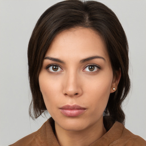 Neutral white young-adult female with medium  brown hair and brown eyes