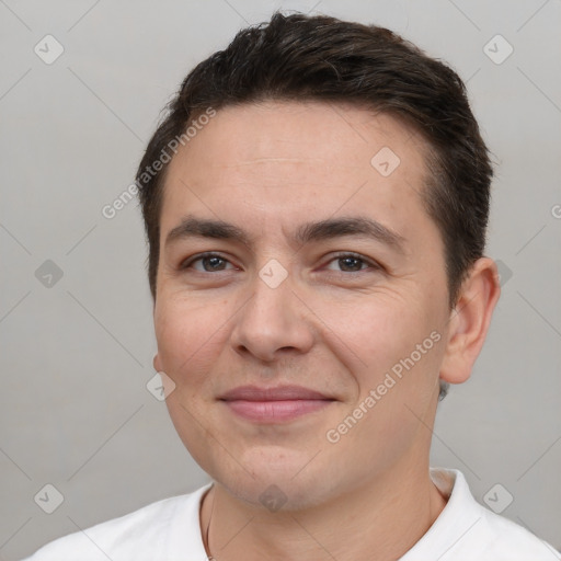 Joyful white young-adult male with short  brown hair and brown eyes