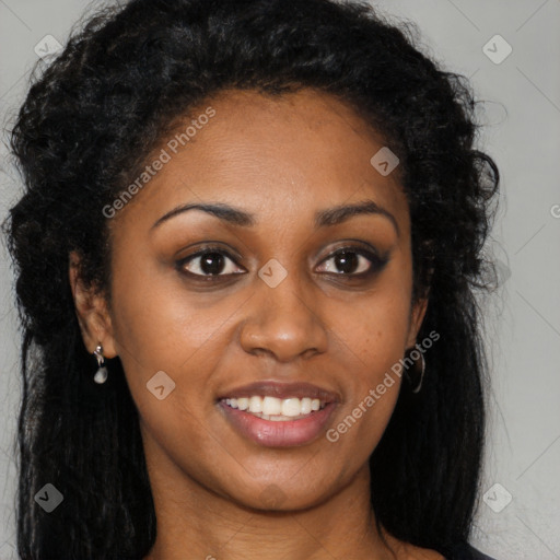 Joyful black young-adult female with long  brown hair and brown eyes