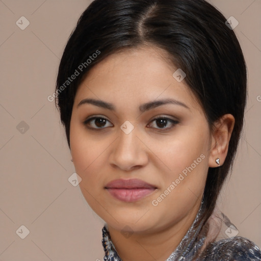 Joyful latino young-adult female with medium  brown hair and brown eyes