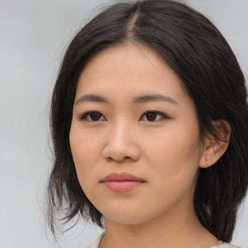 Neutral asian young-adult female with medium  brown hair and brown eyes
