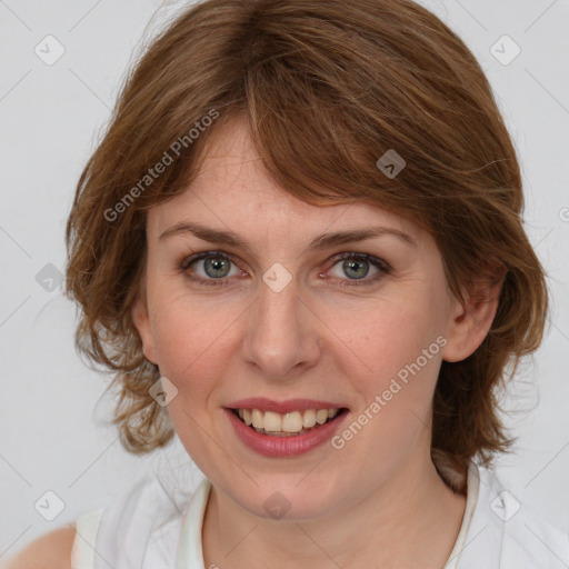 Joyful white young-adult female with medium  brown hair and blue eyes