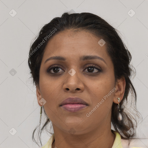 Joyful black young-adult female with medium  brown hair and brown eyes