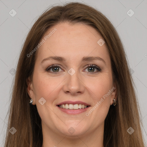 Joyful white adult female with long  brown hair and grey eyes